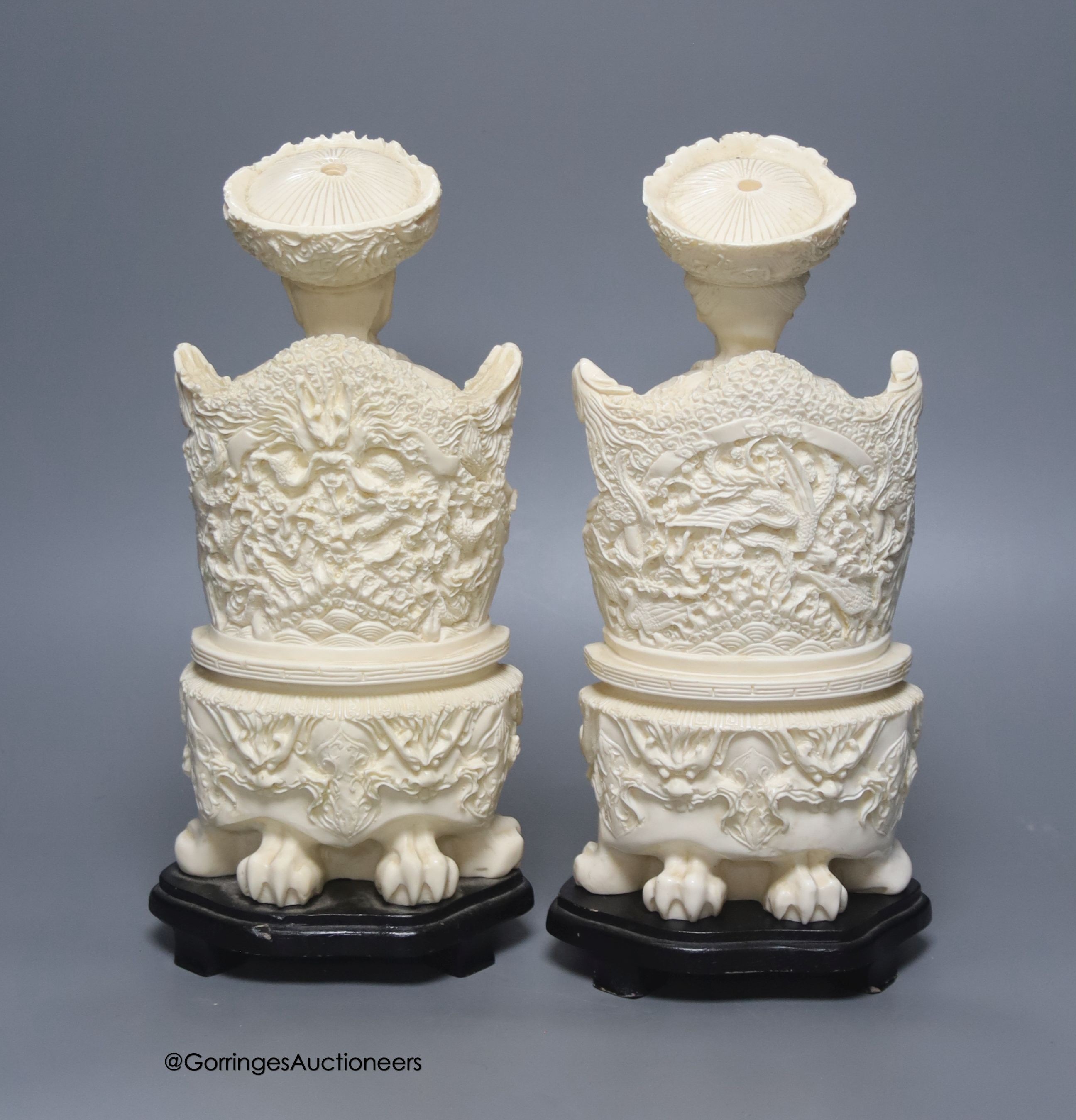 A pair of mid 20th century Chinese faux ivory figures of an Emperor and Empress, height 31cm